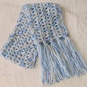 Pretty medium weight scarf in lacy design with shades of blue and apricot.  Stand out this winter!  Unique and handmade with love x