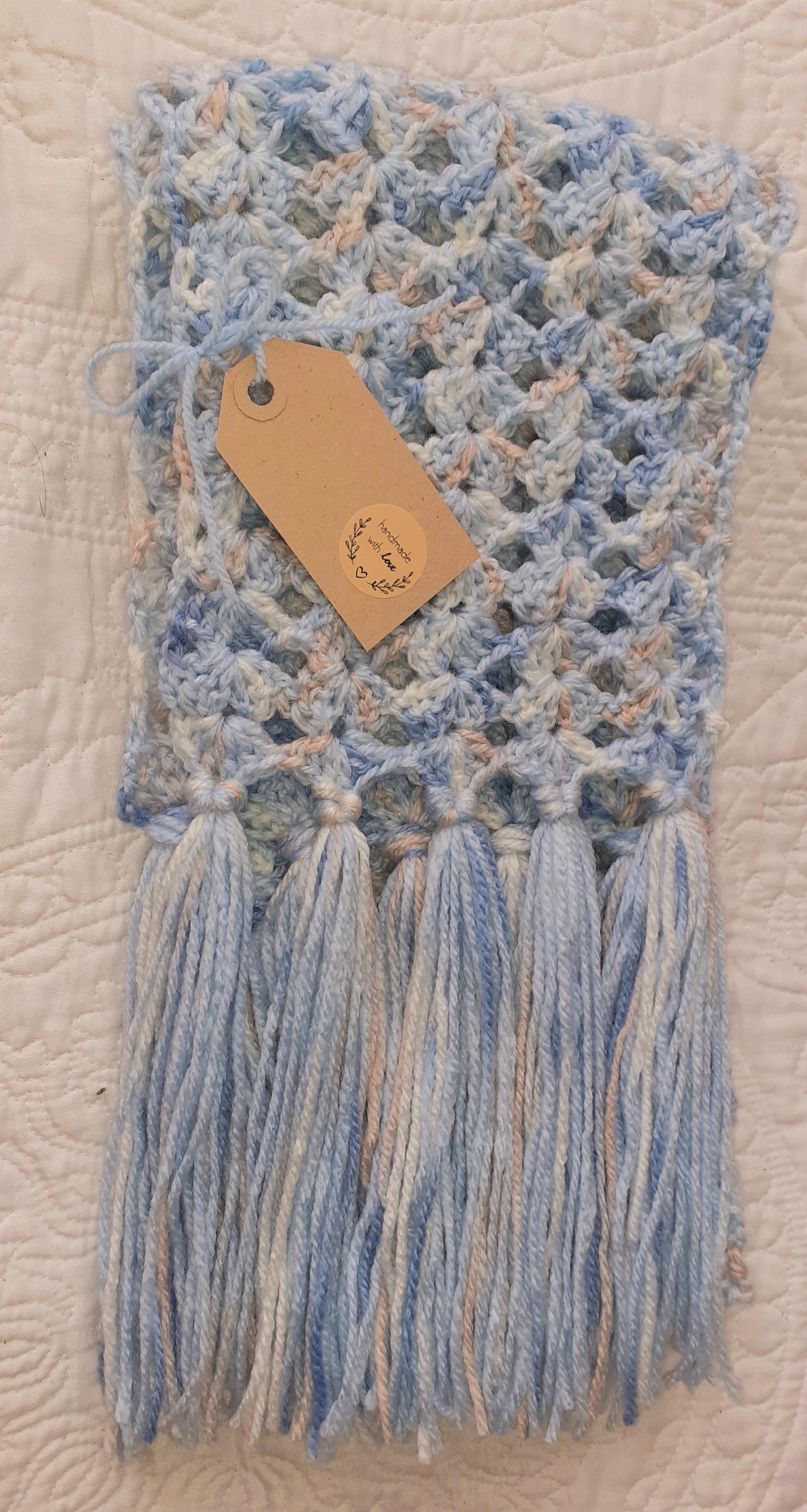 Pretty medium weight scarf in lacy design with shades of blue and apricot.  Stand out this winter!  Unique and handmade with love x