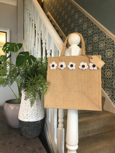 Gorgeous artisan jute bags with hand crafted crochet decoration.
