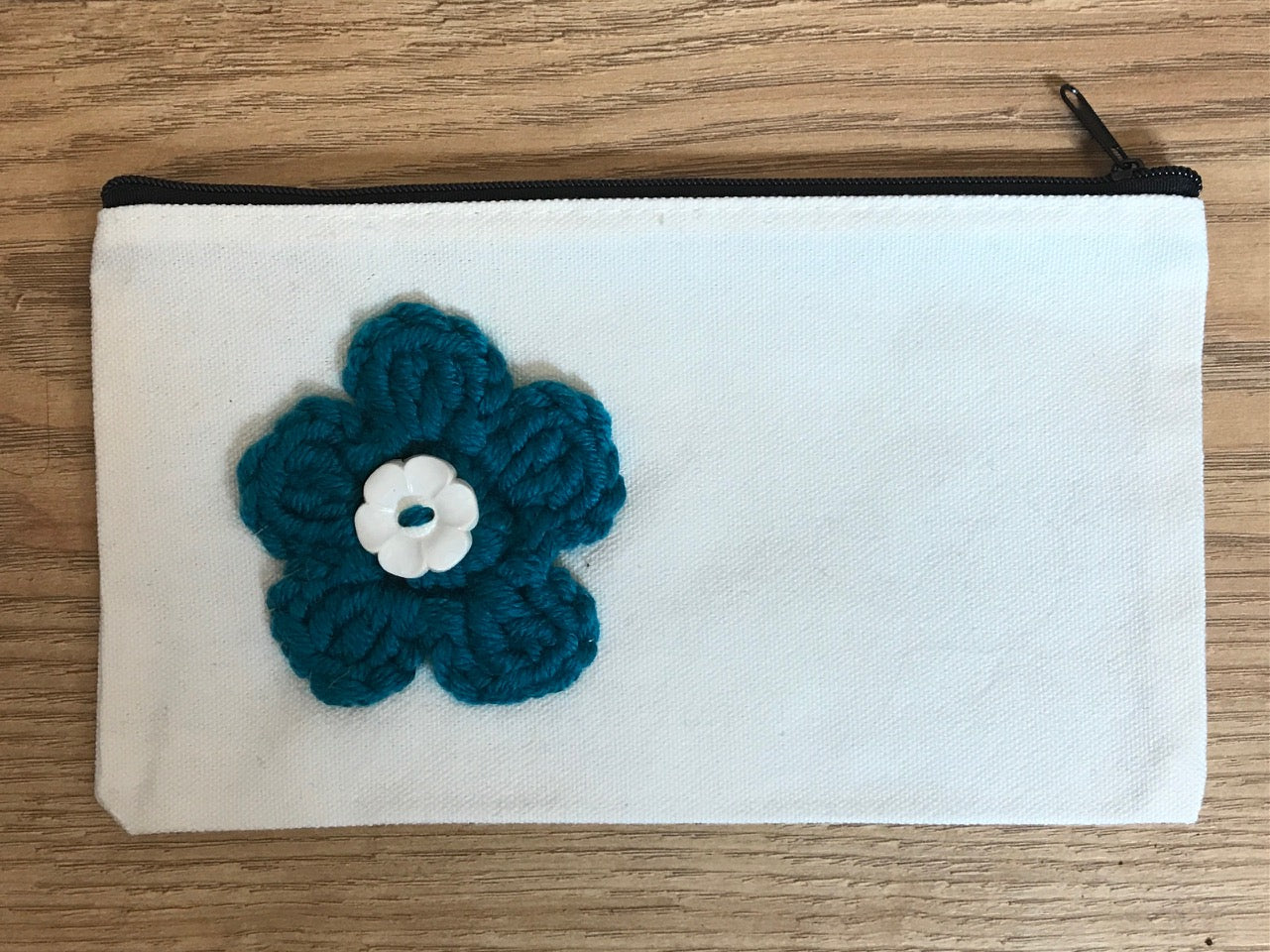 Canvas pouches with hand crocheted decoration