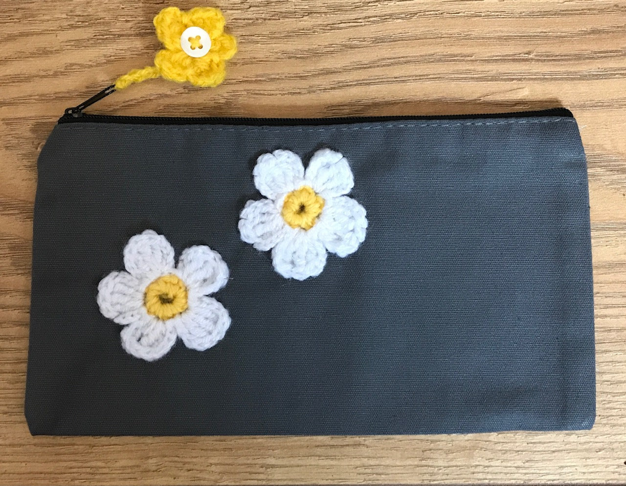 Canvas pouches with hand crocheted decoration