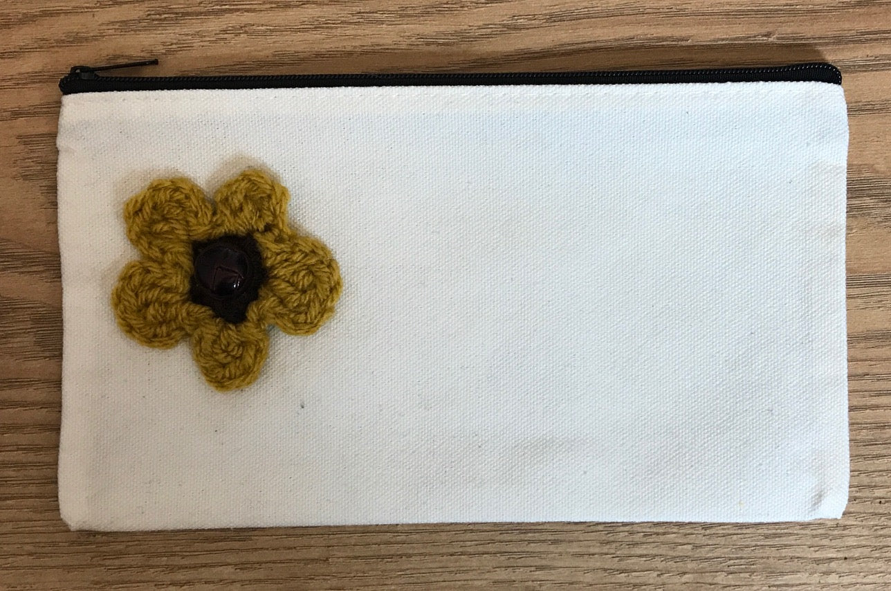 Canvas pouches with hand crocheted decoration