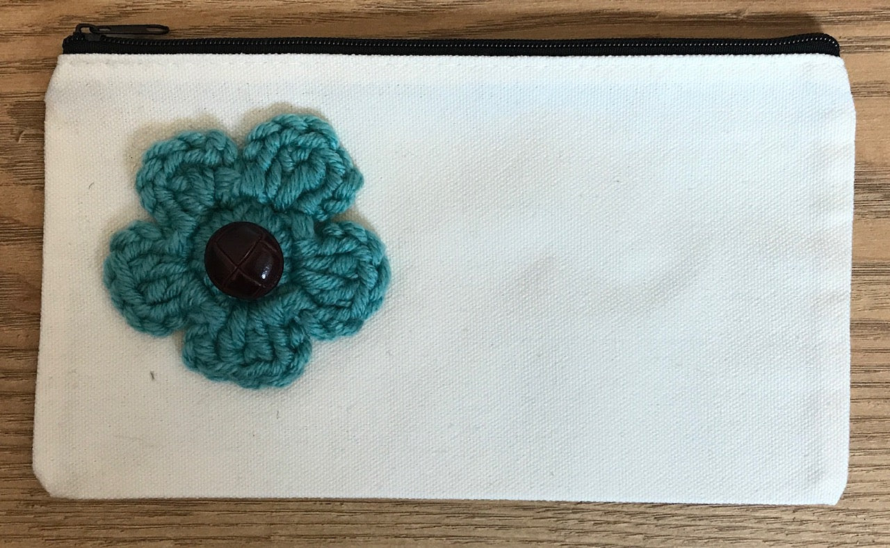 Canvas pouches with hand crocheted decoration