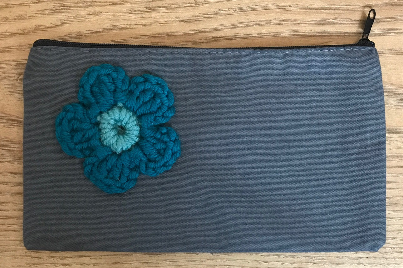 Canvas pouches with hand crocheted decoration