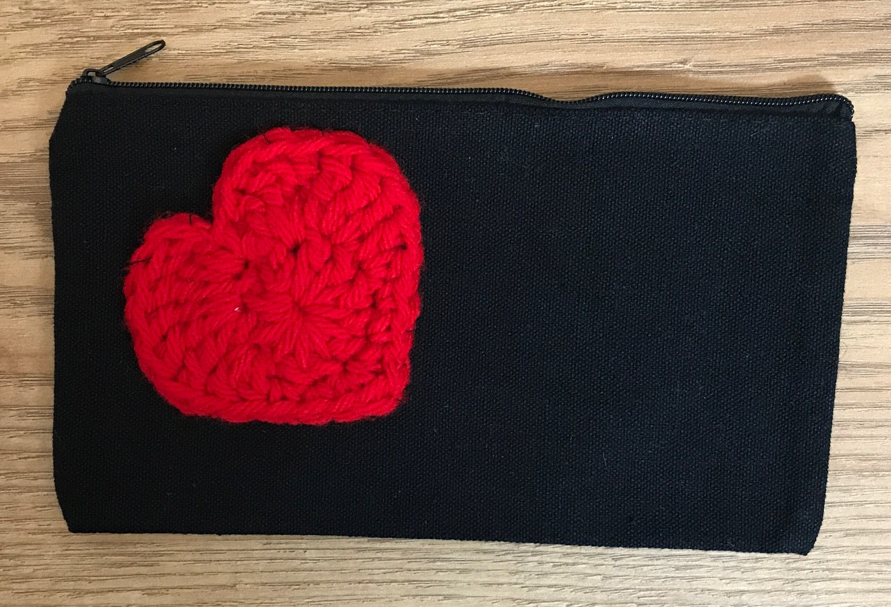 Canvas pouches with hand crocheted decoration