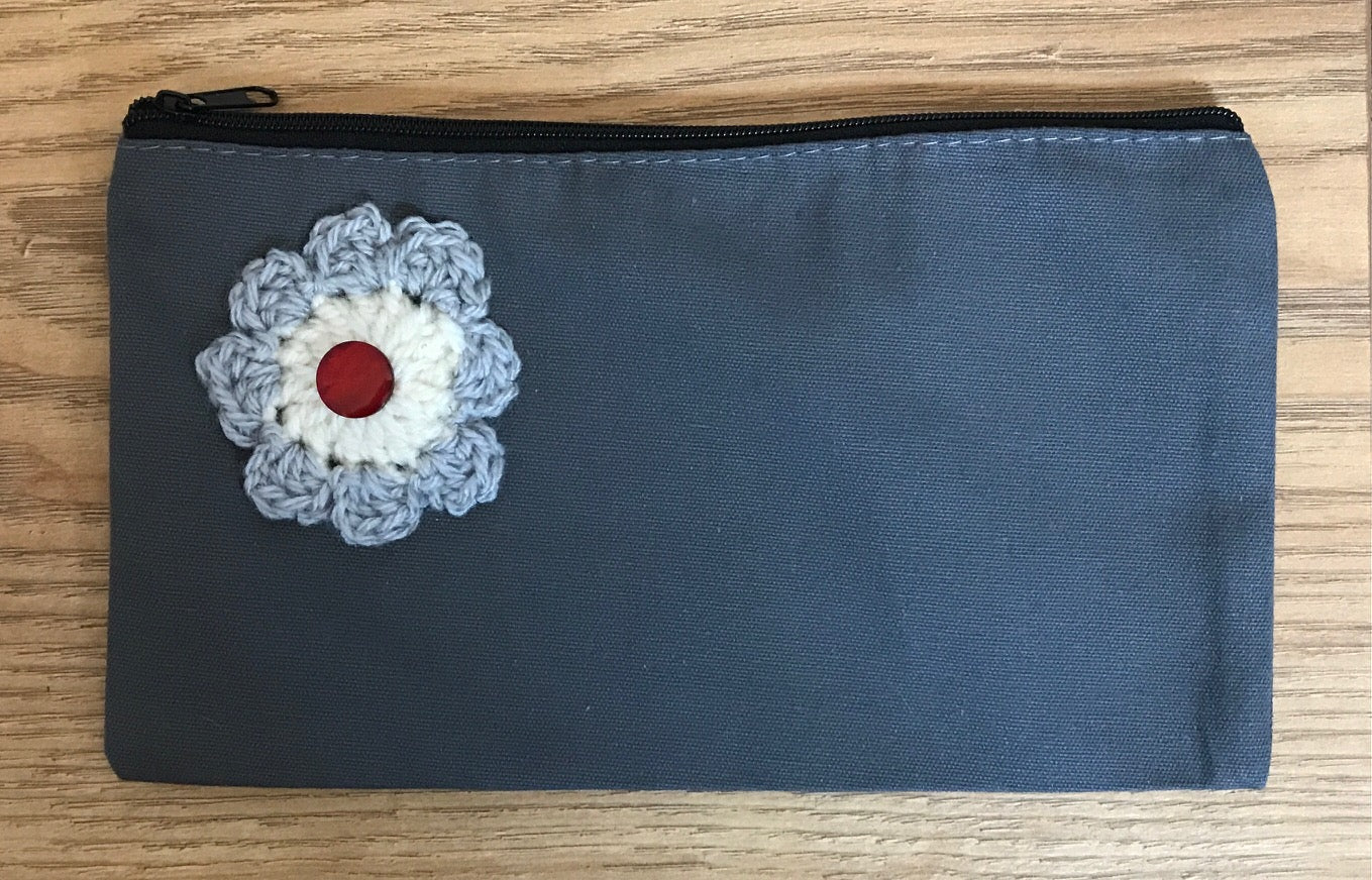 Canvas pouches with hand crocheted decoration