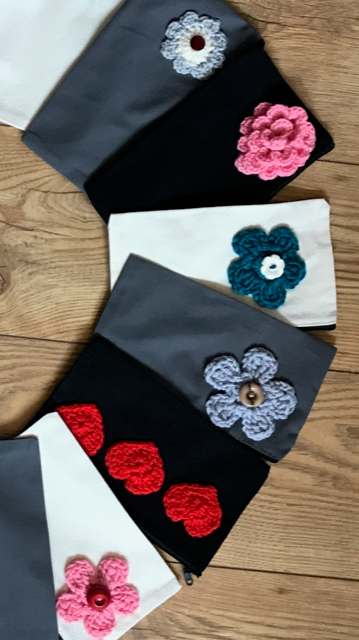 Canvas pouches with hand crocheted decoration